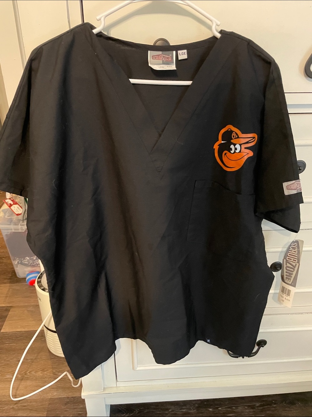 Landau Black Scrub Top with Orange Baltimore Orioles Logo